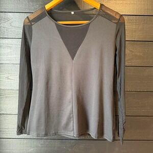 Sleek black long sleeve top with mesh shoulder and sleeve detailing